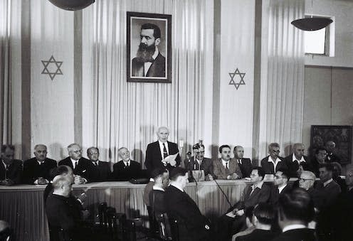 <span class="caption">David Ben-Gurion formally declares Israel as an independent state on May 14 1948.</span> <span class="attribution"><span class="source">Rudi Weissenstein - Israel Ministry of Foreign Affairs</span></span>