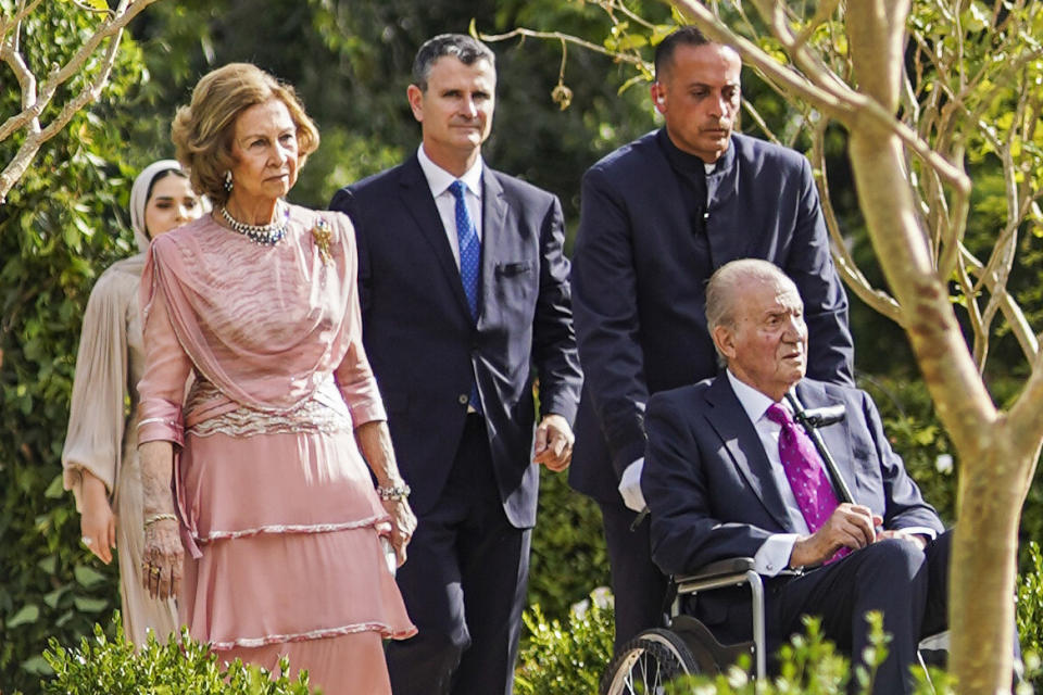 Former King of Spain Juan Carlos, in a wheelchair, and his wife Sofia arrive at the marriage ceremony of Crown Prince Hussein and Saudi architect Rajwa Alseif on Thursday, June 1, 2023, in Amman, Jordan. (Royal Hashemite Court via AP)