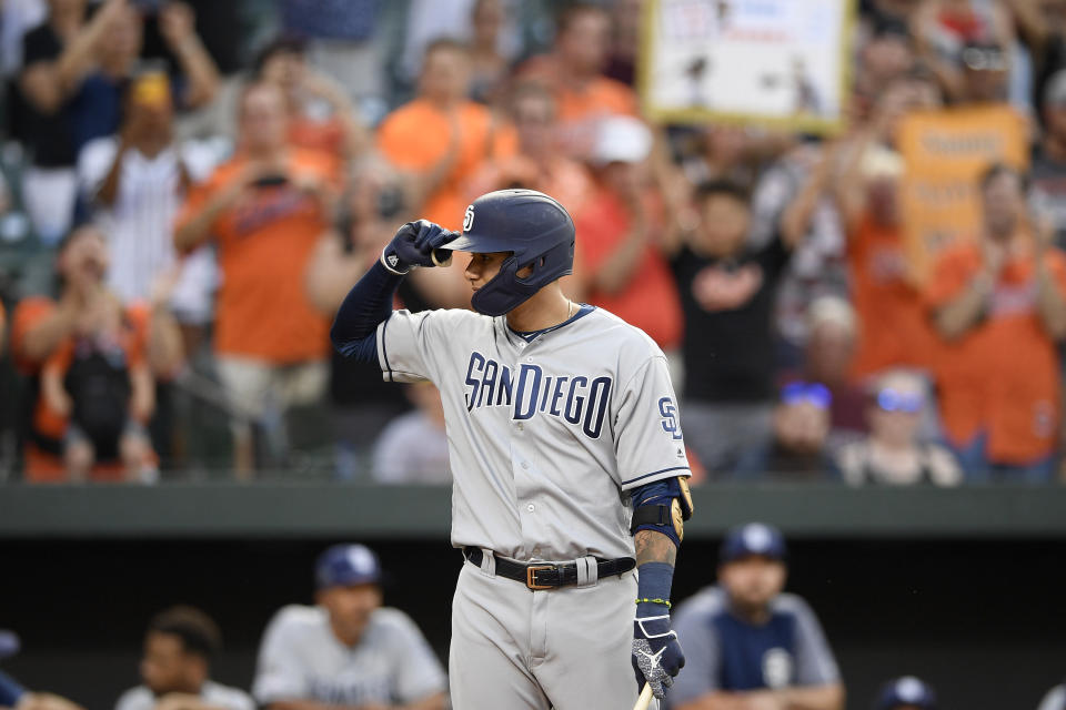 San Diego Padres' Manny Machado acknowledges the crowd during the first inning of a baseball game against his former team, the Baltimore Orioles, Tuesday, June 25, 2019, in Baltimore. (AP Photo/Nick Wass)