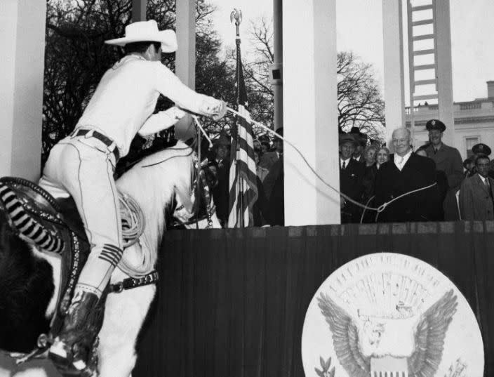 Dwight D. Eisenhower lassoed by a California cowboy on a horse.