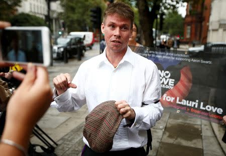 Lauri Love speaks to members of the media as he arrives for his extradition hearing at Westminster Magistrates' Court in London, Britain September 16, 2016. REUTERS/Peter Nicholls