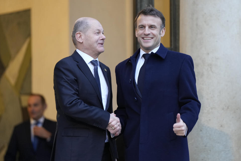 French President Emmanuel Macron, right, welcomes German Chancellor Olaf Scholz at the Elysee Palace in Paris, Monday, Feb. 26, 2024. More than 20 European heads of state and government and other Western officials are gathering in a show of unity for Ukraine, signaling to Russia that their support for Kyiv isn't wavering as the full-scale invasion grinds into a third year. (AP Photo/Lewis Joly)