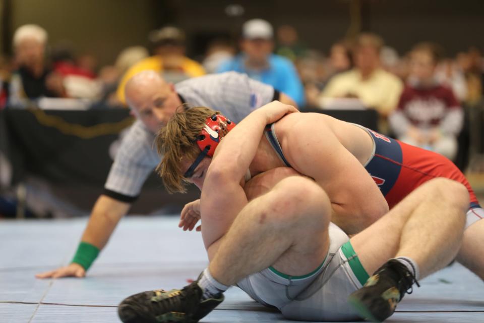 Seaman's Jaxon Thomas works for a pin in the 5A 285 lb. state title match on Saturday at Hartman Arena.