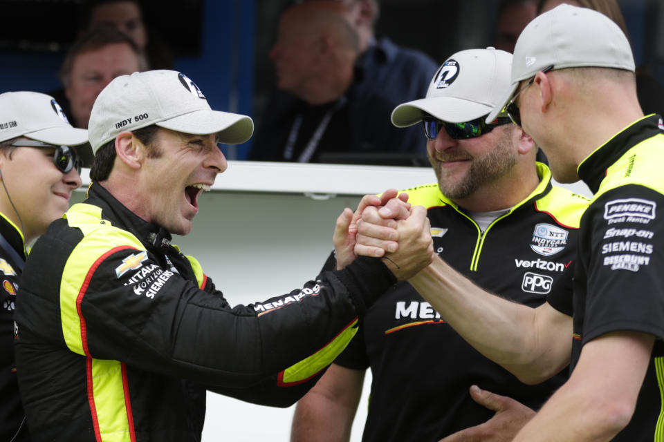 Simon Pagenaud, of France, celebrates with his crew after winning the pole during qualifications for the Indianapolis 500 IndyCar auto race at Indianapolis Motor Speedway, Sunday, May 19, 2019 in Indianapolis. (AP Photo/Michael Conroy)