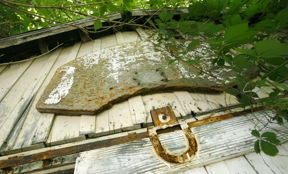 The garage at the home where Larry Bird grew up in French Lick was modest and featured an old, rusty hoop.
