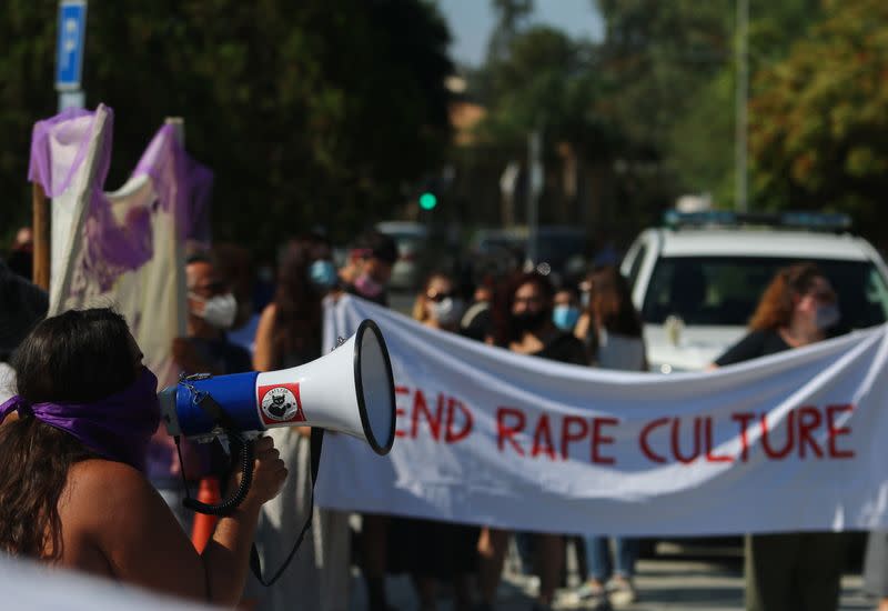 Activists take part in a demonstration supporting a British woman who says she was pressured into retracting a claim of gang rape, outside the Supreme court in Nicosia