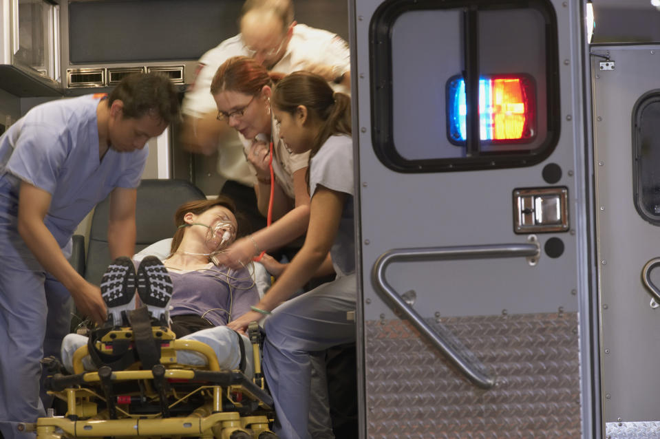 medics getting a person into an ambulance