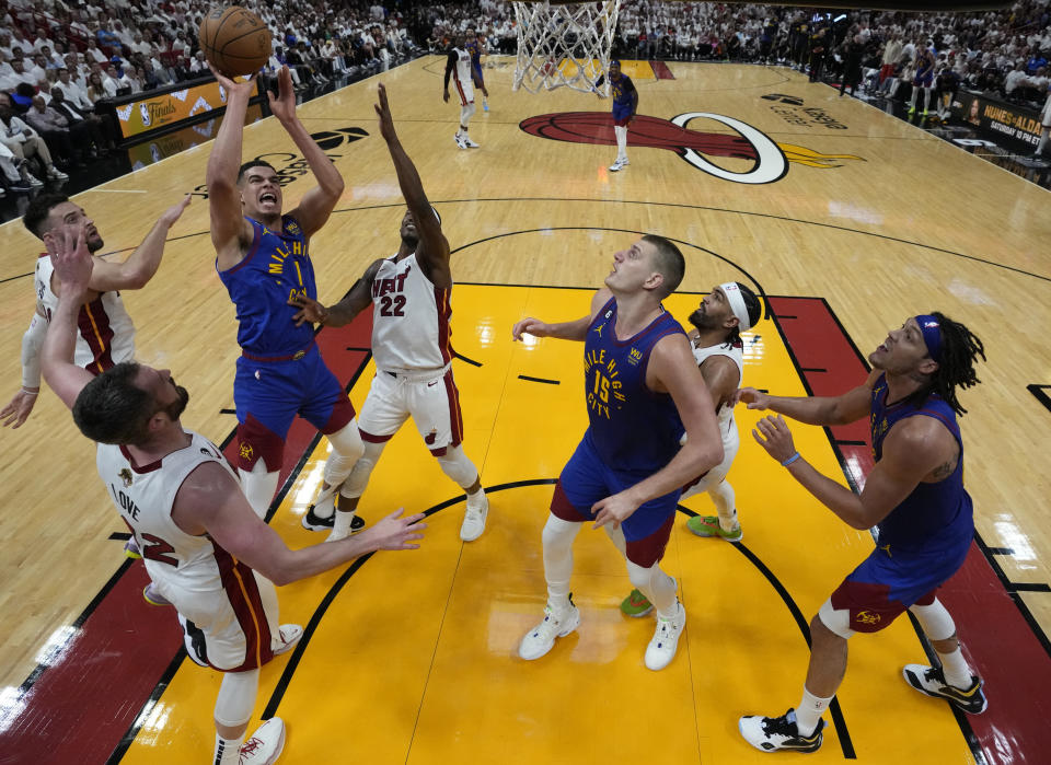 Denver Nuggets forward Michael Porter Jr. (1) drives to the basket during the second half of Game 3 of the NBA Finals basketball game against the Miami Heat, Wednesday, June 7, 2023, in Miami. (AP Photo/Wilfredo Lee)