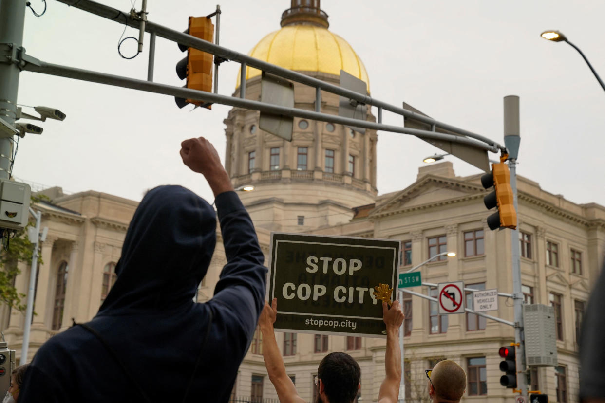 People protest agains the controversial “Cop City” project as the clear cutting of trees begins near Atlanta