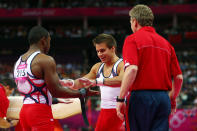 LONDON, ENGLAND - JULY 30: John Orozco of the United States gives Samuel Mikulak of the United States a five after Orozco competes on the pommel horse in the Artistic Gymnastics Men's Team final on Day 3 of the London 2012 Olympic Games at North Greenwich Arena on July 30, 2012 in London, England. (Photo by Michael Steele/Getty Images)