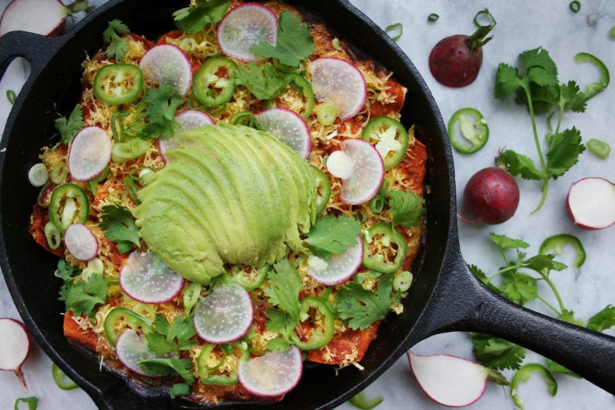 Vegan sweet potato and kale enchiladas contain mood-boosting properties & dense nutrient profiles.