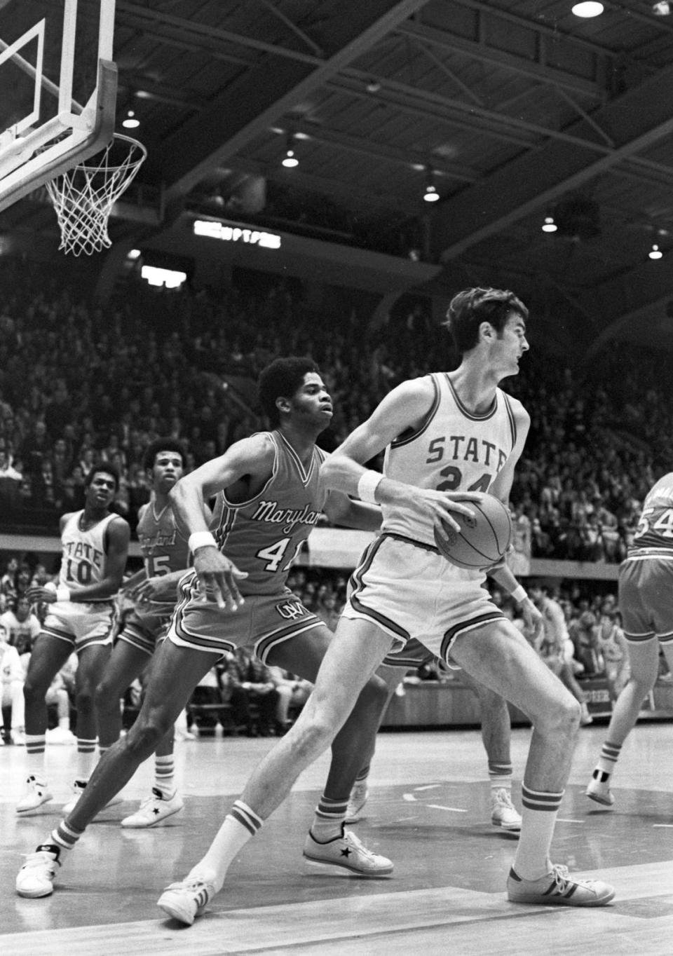 NC State’s Tommy Burleson moves against Maryland’s Len Elmore in 1974 action in Reynolds Coliseum.