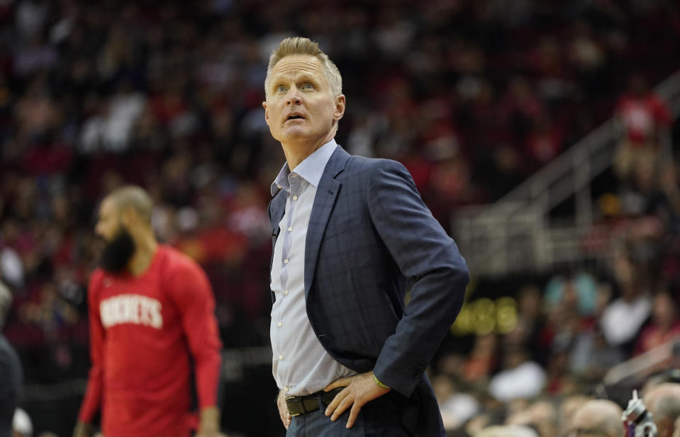 Golden State Warriors coach Steve Kerr looks up at the scoreboard during the first half of an NBA basketball game against the Houston Rockets Wednesday, Nov. 6, 2019, in Houston. (AP Photo/David J. Phillip)