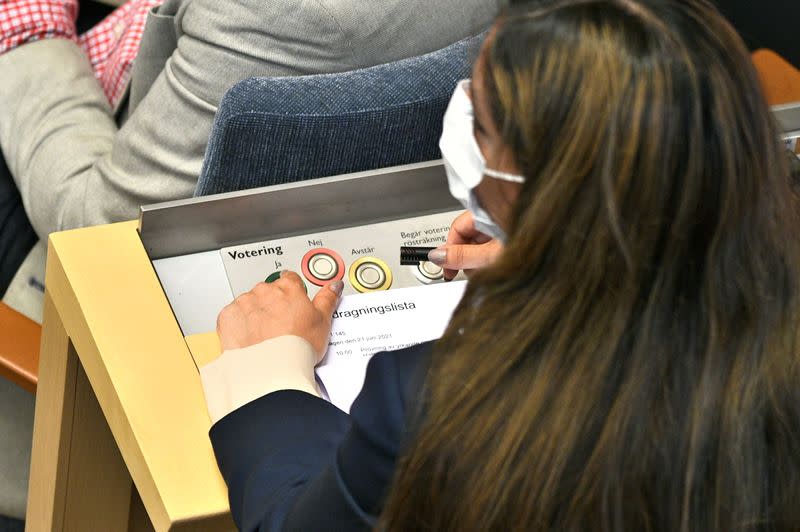 A member of the Swedish parliament votes during the no-confidence vote against PM Stefan Lofven, in Stockholm