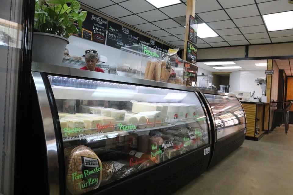 Behind the county, a variety of specialty Italian-style meats and cheeses are at the ready, Aug. 7, 2023 at Aquino's Deli in downtown Carlsbad.