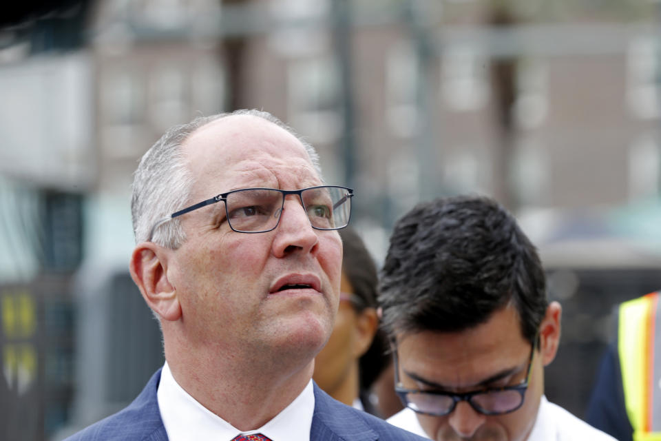 Louisiana Gov. John Bel Edwards addresses reporters near the Hard Rock Hotel, Thursday, Oct. 17, 2019, in New Orleans. The 18-story hotel project that was under construction collapsed last Saturday, killing three workers. Two bodies remain in the wreckage. (AP Photo/Gerald Herbert)