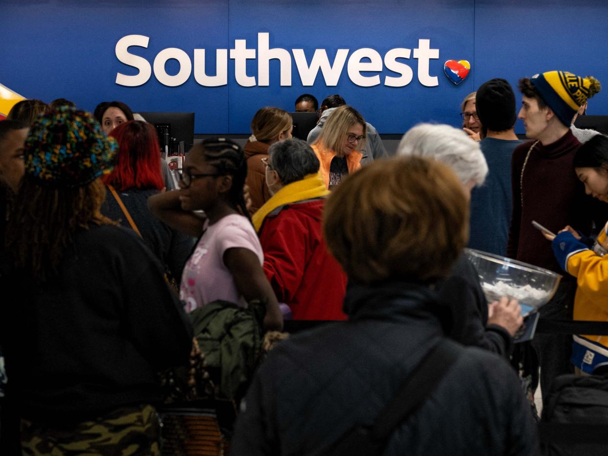 Travellers wait in line at the Southwest Airlines ticketing counter at Nashville International Airport