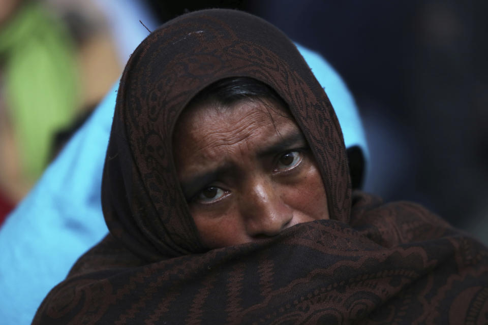 An Indigenous Tzotzil woman waits for her turn to vote in a non-binding national referendum on whether Mexican ex-presidents should be tried for any illegal acts during their time in office, at the Corazon de Maria community, in Chiapas state, Mexico, Sunday, August 1, 2021. (AP Photo/Emilio Espejel)