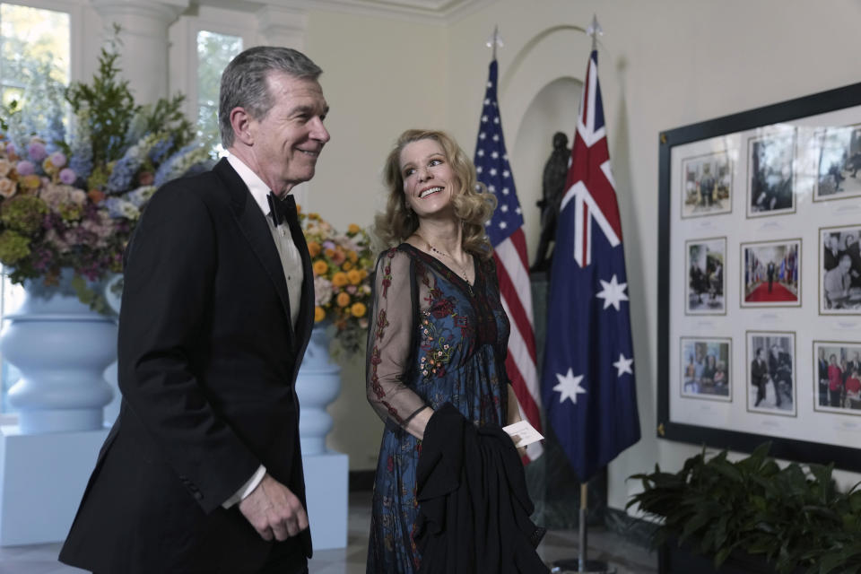 Gov. Roy Cooper of North Carolina and Kristin Cooper, arrive for the State Dinner hosted by President Joe Biden and first lady Jill Biden in honor of Australian Prime Minister Anthony Albanese, at the White House in Washington, Wednesday, Oct. 25, 2023, in Washington. (AP Photo/Manuel Balce Ceneta)