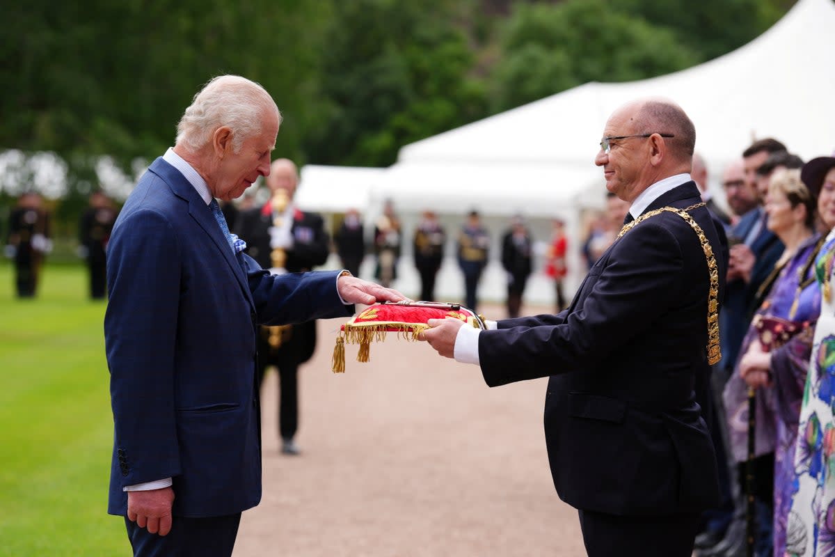 King Charles receives the keys to the City of Edinburgh from Lord Provost Councillor Robert Aldridge during the Ceremony of the Keys  (via REUTERS)