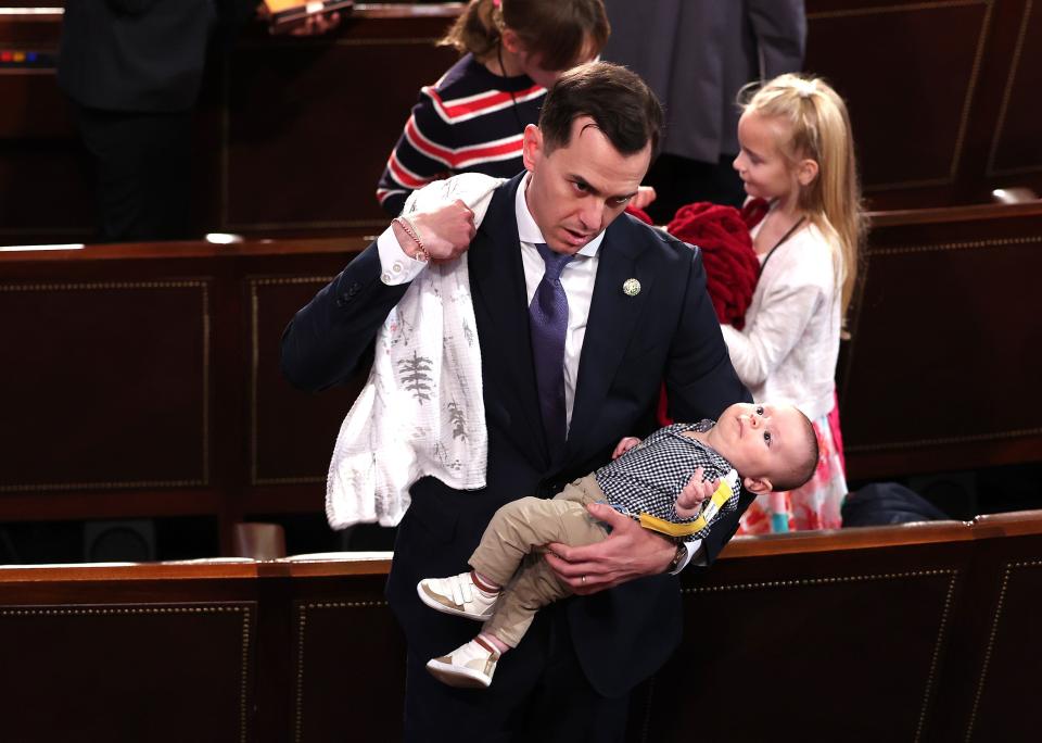 Incoming U.S. Rep. Robert Menendez Jr. (D-NJ) holds his son Robert as his daughter Olivia sits near by, during the first day of the 118th Congress in the House Chamber of the U.S. Capitol Building on January 03, 2023 in Washington, DC.