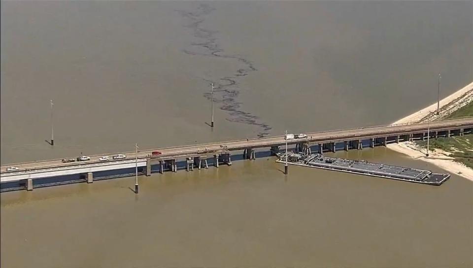 A bridge in Galveston Texas was hit by a barge on Wednesday, causing part of an attached railway to collapse (AP)