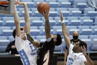 North Carolina forward Walker Kessler (13) and forward Garrison Brooks (15) guard Florida State guard Anthony Polite (2) during the second half of an NCAA college basketball game in Chapel Hill, N.C., Saturday, Feb. 27, 2021. (AP Photo/Gerry Broome)