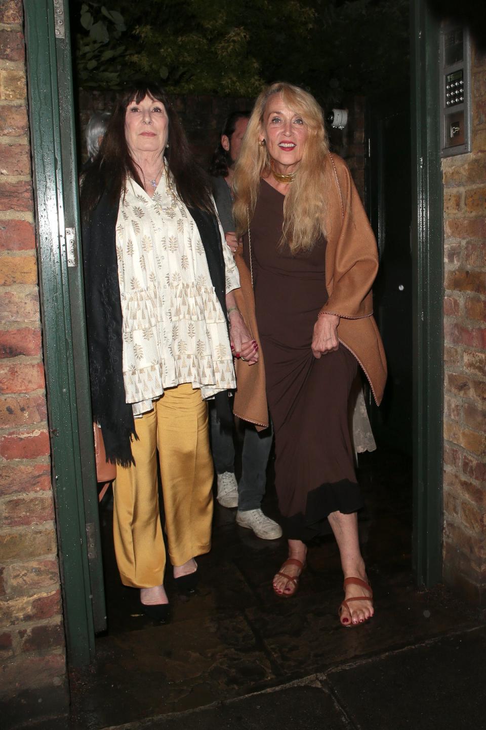 Anjelica Huston and Jerry Hall leaving Mick Jagger’s birthday party (GC Images)