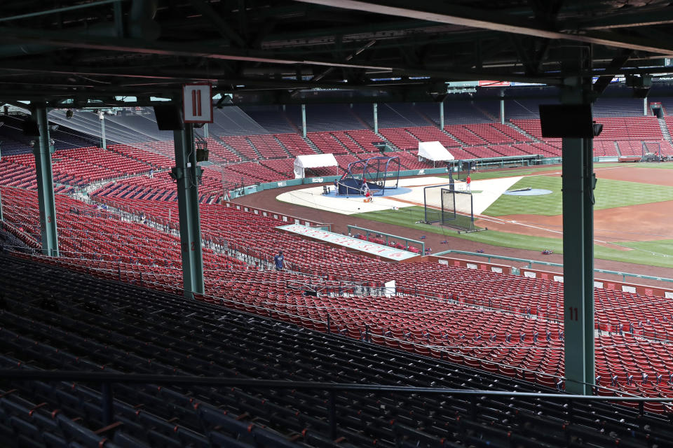 Boston Red Sox players take batting practice during baseball training camp at Fenway Park, Monday, July 6, 2020, in Boston. (AP Photo/Elise Amendola)