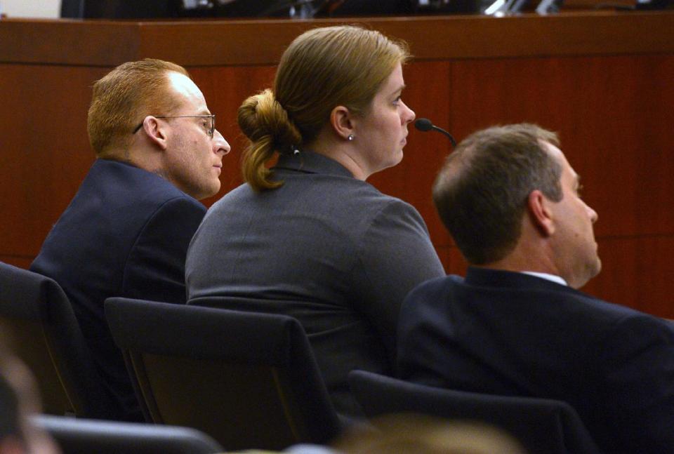 Eric Millerberg, left, and his defense attorneys Haylee Mills, center, and Randall Marshall listen to opening statements by Deputy Weber County prosecuting attorney Chris Shaw, Wednesday, Feb. 12, 2014, in Ogden, Utah. Millerberg has been charged with injecting his 16-year-old baby sitter, Alexis Rasmussen, with a fatal dose of heroin and methamphetamine, then taking his wife and infant daughter along to dump Rasmussen's body near a river. (AP Photo/The Salt Lake Tribune, Leah Hogsten, Pool)