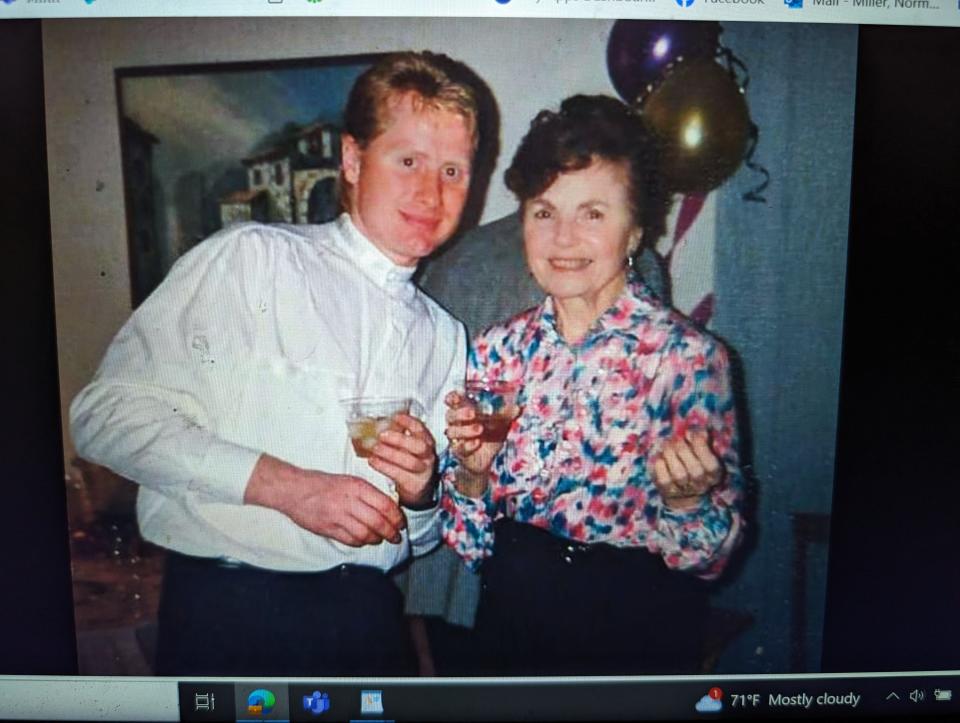 David V. Cox is shown pictured with his mother, June Cox, in the Facebook group, "In Memory of David V. Cox." The body of Cox, of Natick, was found in Medfield in 1994. No one has been charged.