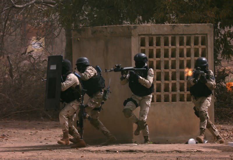 Soldiers from Burkina Faso participate in a simulated raid during the U.S. sponsored Flintlock exercises in Ouagadougou, Burkina Faso