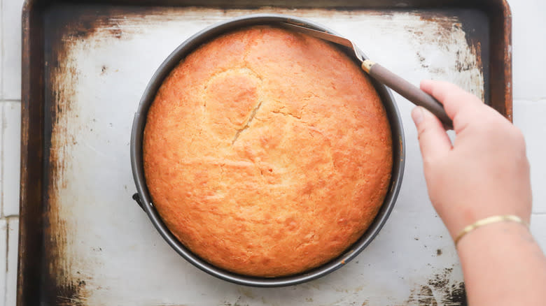 Removing hot cake from pan