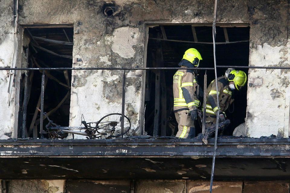 Firefighters remove a charred body inside a burned block building in Valencia, Spain, Friday, Feb. 23, 2024 (Copyright 2024 The Associated Press. All rights reserved)