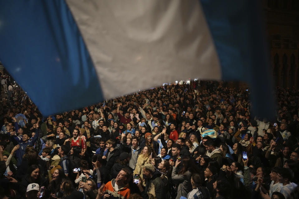 Argentina fans celebrate in central Barcelona, Spain after the World Cup semi final soccer match between Argentina and Croatia in Qatar, Tuesday, Dec. 13, 2022. Argentina defeated Croatia 3-0. (AP Photo/Emilio Morenatti)