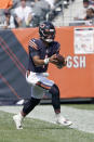 Chicago Bears quarterback Justin Fields carries the ball during the first half of an NFL football game against the Cincinnati Bengals Sunday, Sept. 19, 2021, in Chicago. (AP Photo/David Banks)