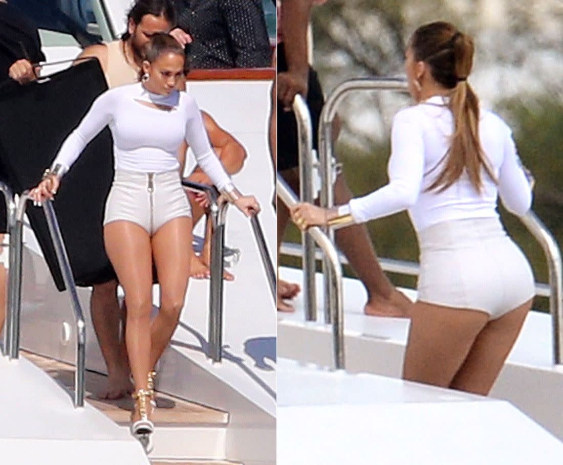 Jennifer Lopez is turning up the heat in Miami. The star was seen soaking up the sun in a white-hot outfit -- complete with a peek-a-boo top and a bodacious pair of hot pants -- while filming a video aboard a yacht on Feb. 12, 2014.