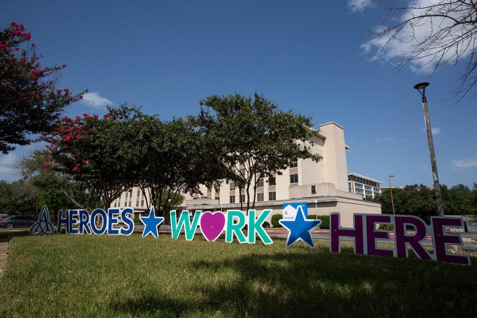 A sign thanking health care workers is displayed outside Ascension Seton Medical Center in 2021. More than a half-million Texans have lost Medicaid coverage since federal COVID-era protections expired.