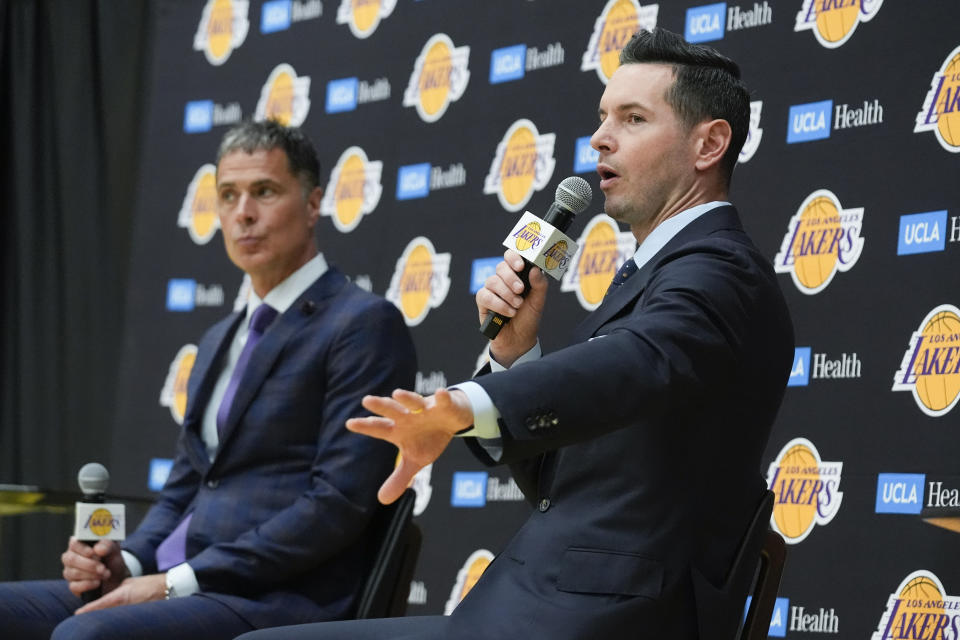 JJ Redick, right, shares a stage with Los Angeles Lakers general manager Rob Pelinka, left, after being introduced as the the new head coach of the Lakers NBA basketball team Monday, June 24, 2024, in El Segundo, Calif. (AP Photo/Damian Dovarganes)