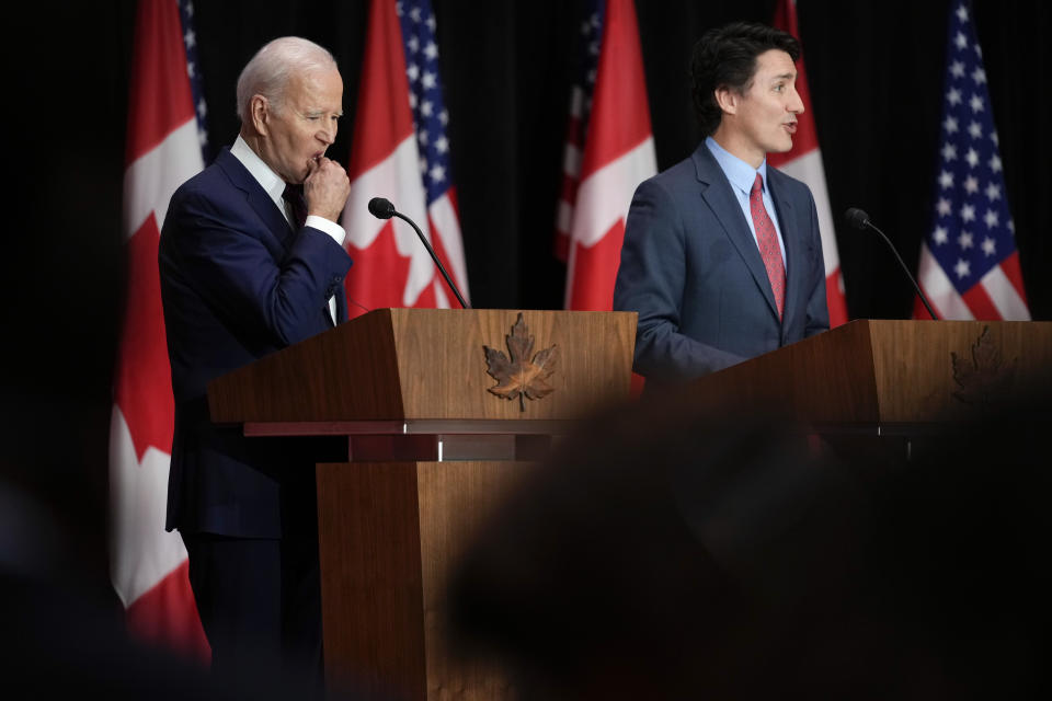 President Joe Biden listens as Canadian Prime Minister Justin Trudeau speaks during a news conference Friday, March 24, 2023, in Ottawa, Canada. (AP Photo/Andrew Harnik)