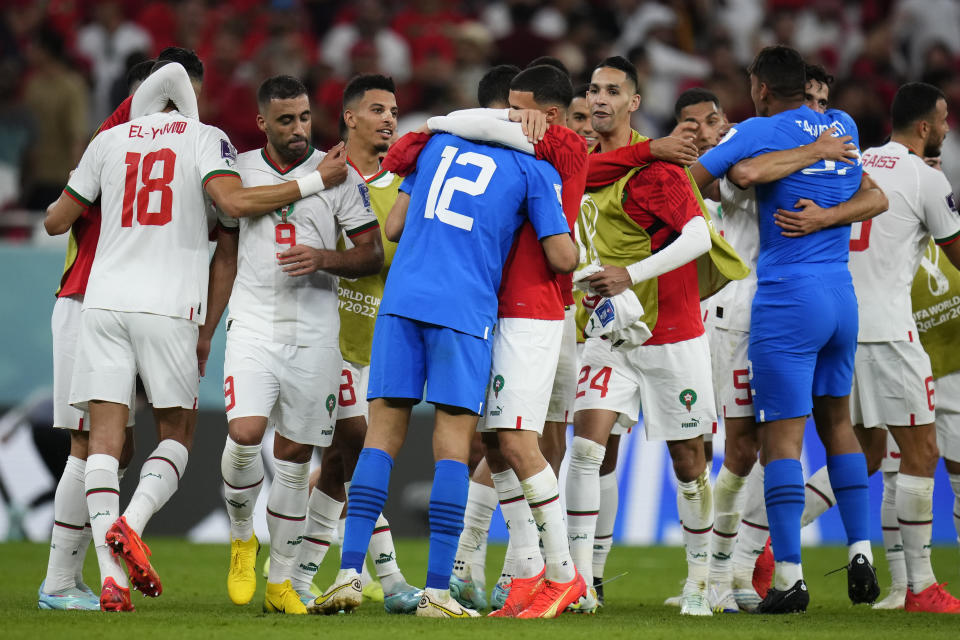 Players of Morococo celebrate defeating Belgium 2-0 in a World Cup group F soccer match at the Al Thumama Stadium in Doha, Qatar, Sunday, Nov. 27, 2022. (AP Photo/Manu Fernandez)