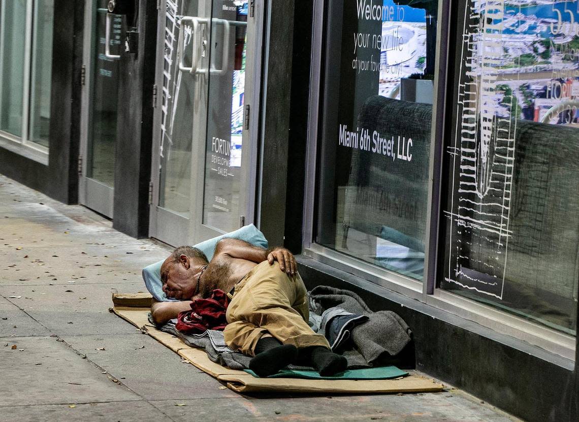 A homeless man sleeps on the sidewalk at NE 6th Street in downtown Miami, during Miami-Dade County’s annual Point-in-Time (PIT) Homeless summer census, where different teams conducted the annual count of those experiencing homelessness from Homestead to Miami Beach to North Miami.