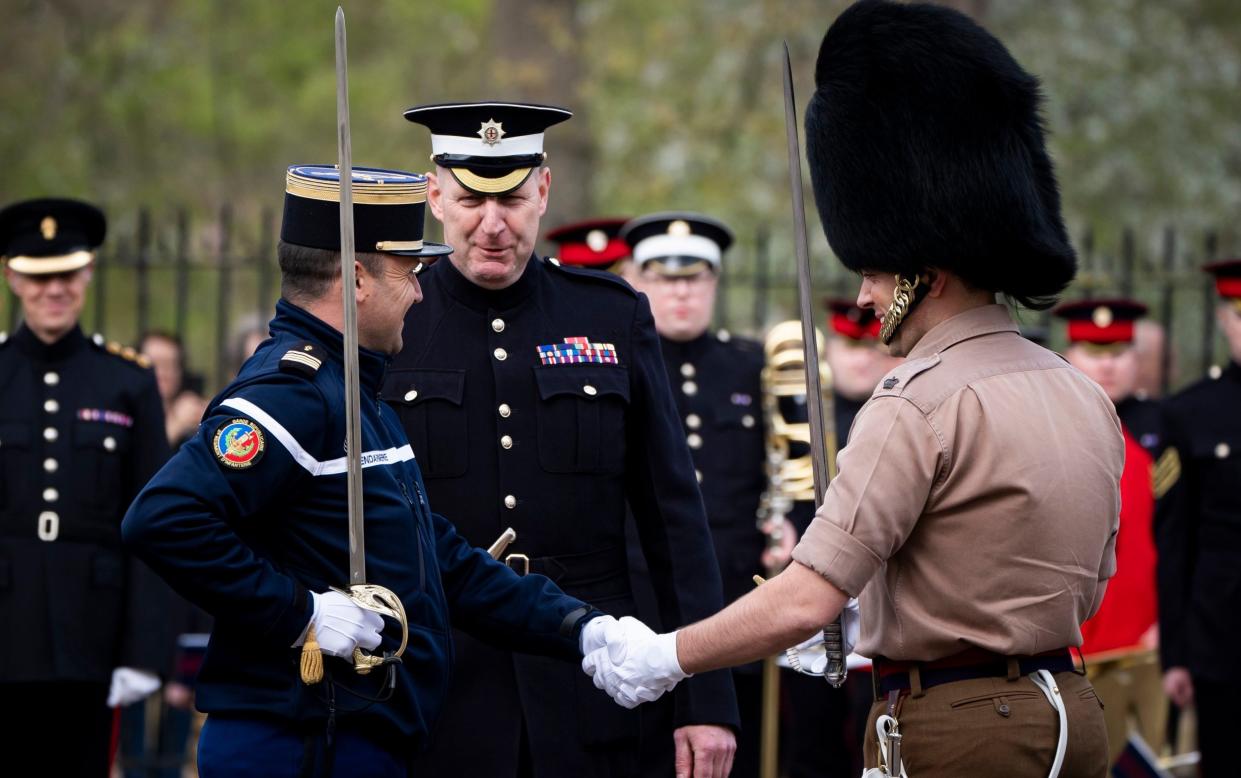 Members of the Gendarmerie's Garde Republicaine and the British Army's Scots Guards during rehearsals on Friday for Changing the Guard