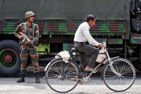 Soldiers patrol the streets in Panchkula, India August 26, 2017. REUTERS/Cathal McNaughton