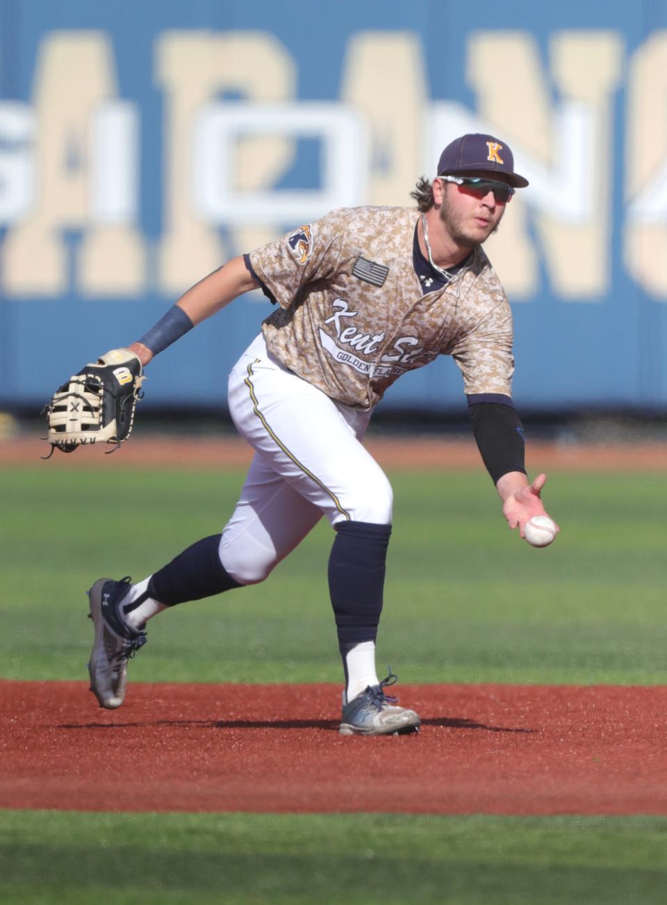 Kent State's Aidan Longwell flips the ball to first during drills before playing Ohio State on April 26.