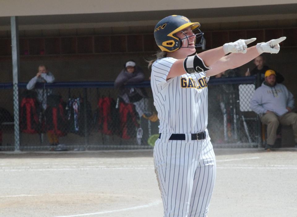 Gaylord's Alexis Kozlowski celebrates after hitting a triple during the district championship game on Saturday, June 4 at Petoskey High School.