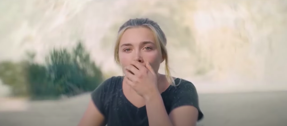 A stunned woman covering her mouth with her hand