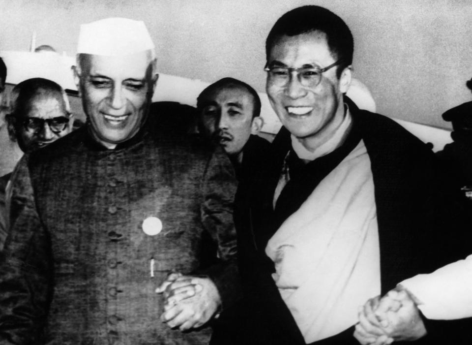 The Dalai Lama&nbsp;(right) is welcomed by the Indian prime minister Nehru (left)&nbsp;on his arrival to Delhi airport where they celebrated the 2,500th anniversary of Buddhism together.&nbsp;