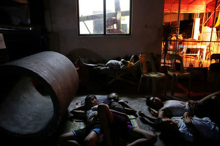 People sleep in the open in Tondo, Manila, Philippines early October 24, 2016. Local residents from the neighbourhood in Manila's slum of Tondo in which several people were killed in drugs related operations, say there are more people sleeping outside their homes since the beginning of the country's war on drugs fearing for their safety. REUTERS/Damir Sagolj