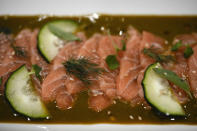 A raw salmon dish prepared by a chef is seen at a test kitchen at the Atlantic Sapphire Bluehouse indoor salmon farm in Homestead, Fla., Thurssday, June 29, 2023. (AP Photo/Rebecca Blackwell)